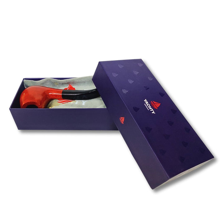 Open purple gift box with a red and black smoking pipe inside on a white background