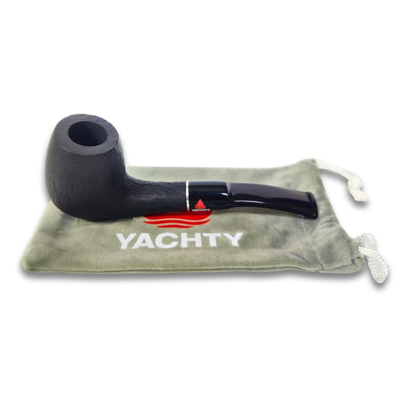 Black smoking tobacco pipe on a green pouch with 'Yachty' branding on a white background