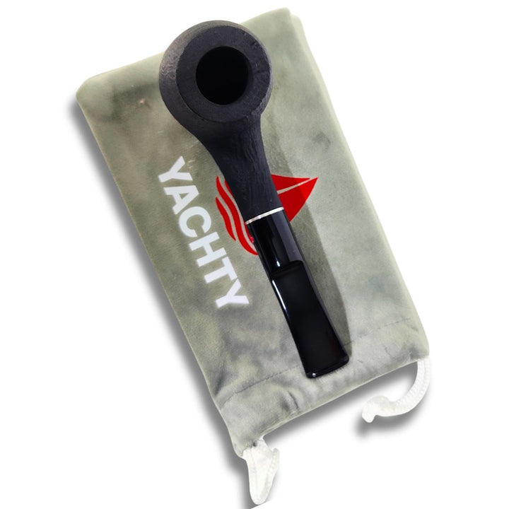 Black cigar pipe on a gray Yachty branded pouch with a white background