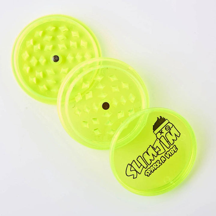 bright yellow plastic grinder on a white background, with 'Slick Jim' branding.