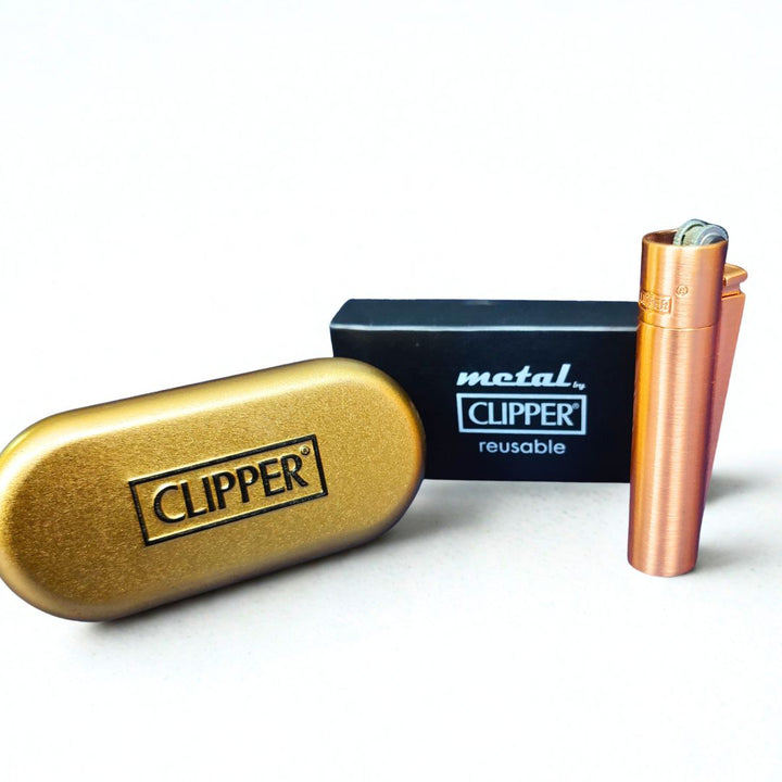 Clipper case and rose gold matte lighter on a white background