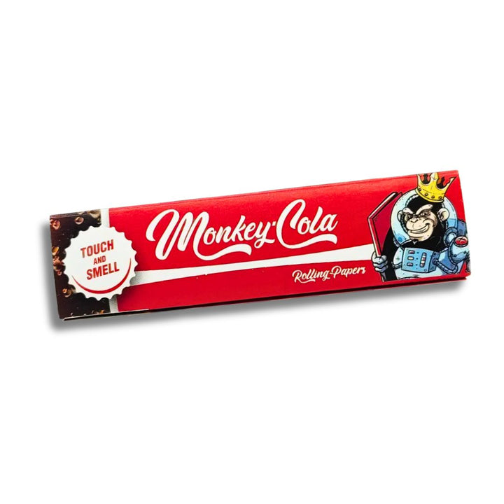 Red packaging of Monkey Cola rolling papers with a cartoon monkey character on a white background